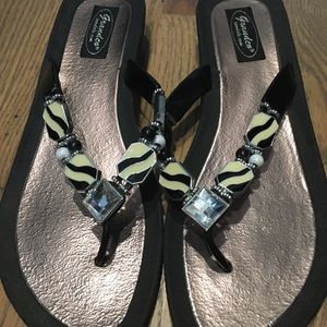 2 pairs of fancy flip flops